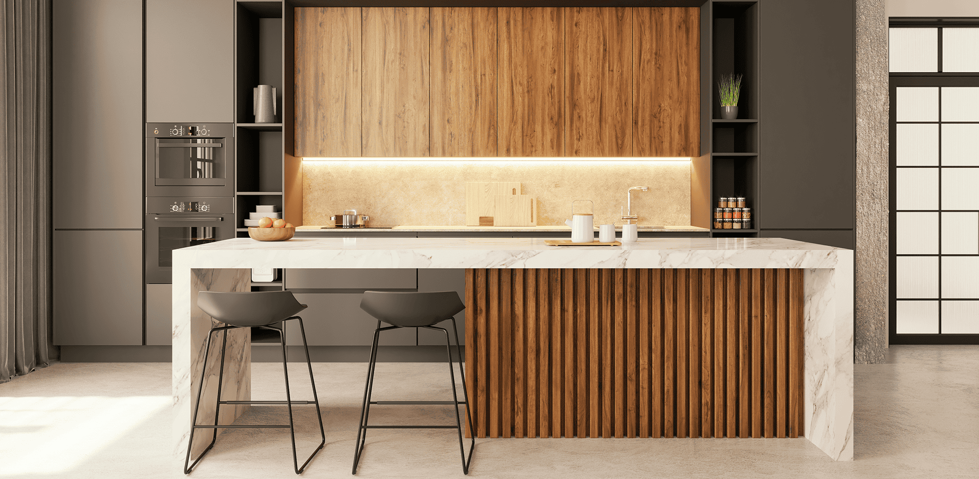 Modern kitchen with marble island and stools.